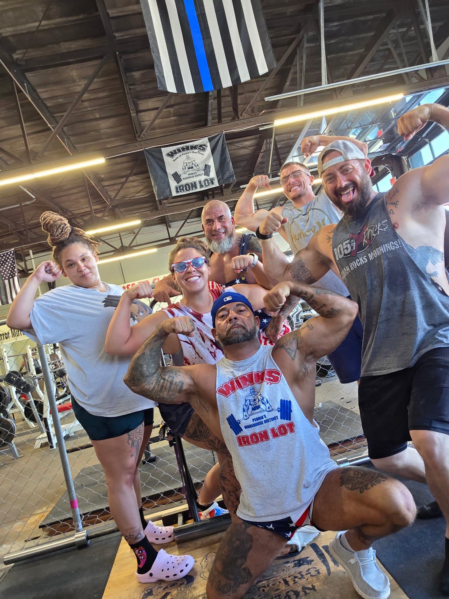 Winks Iron Lot members flexing together