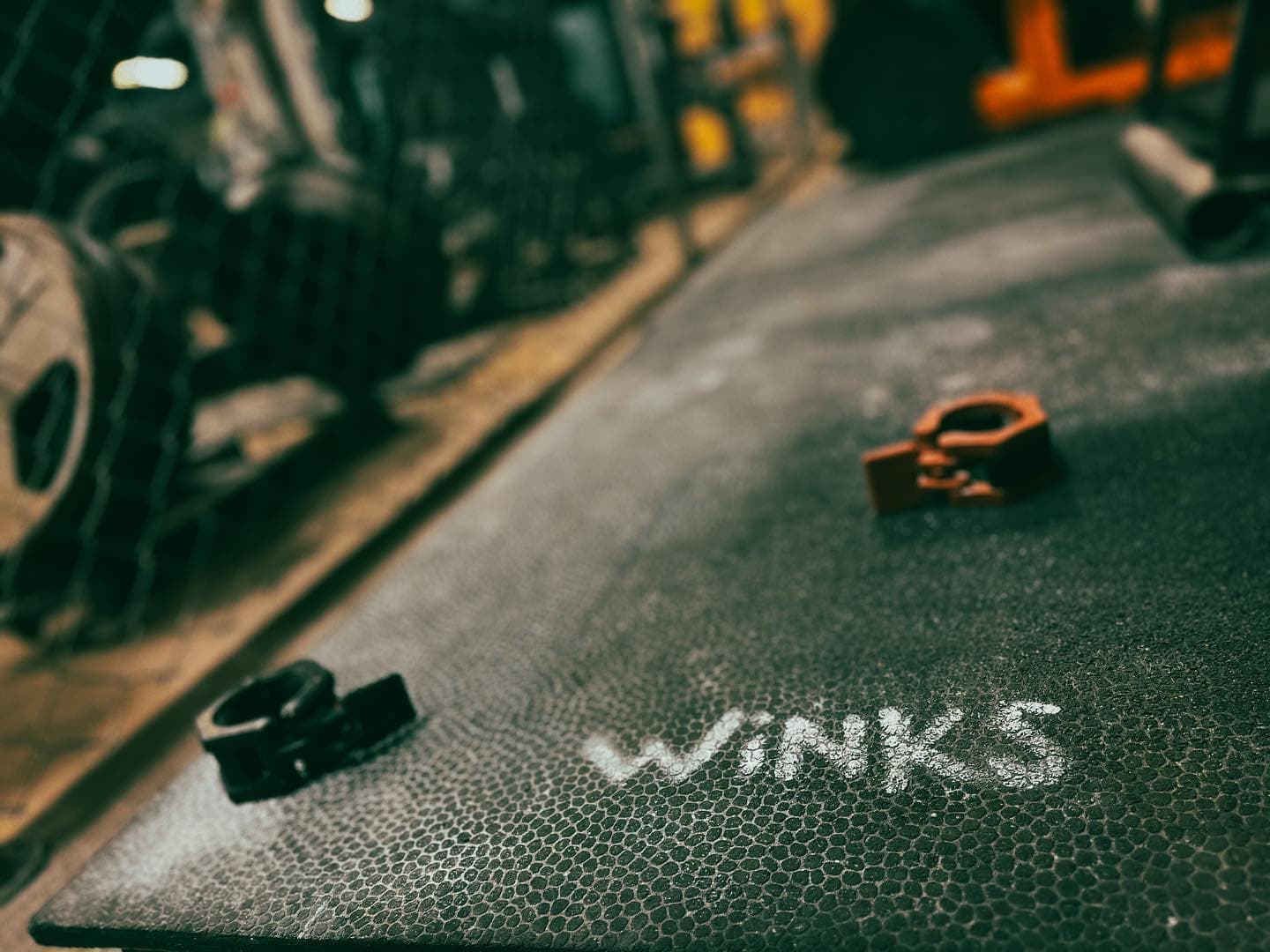 Winks chalk logo on gym floor
